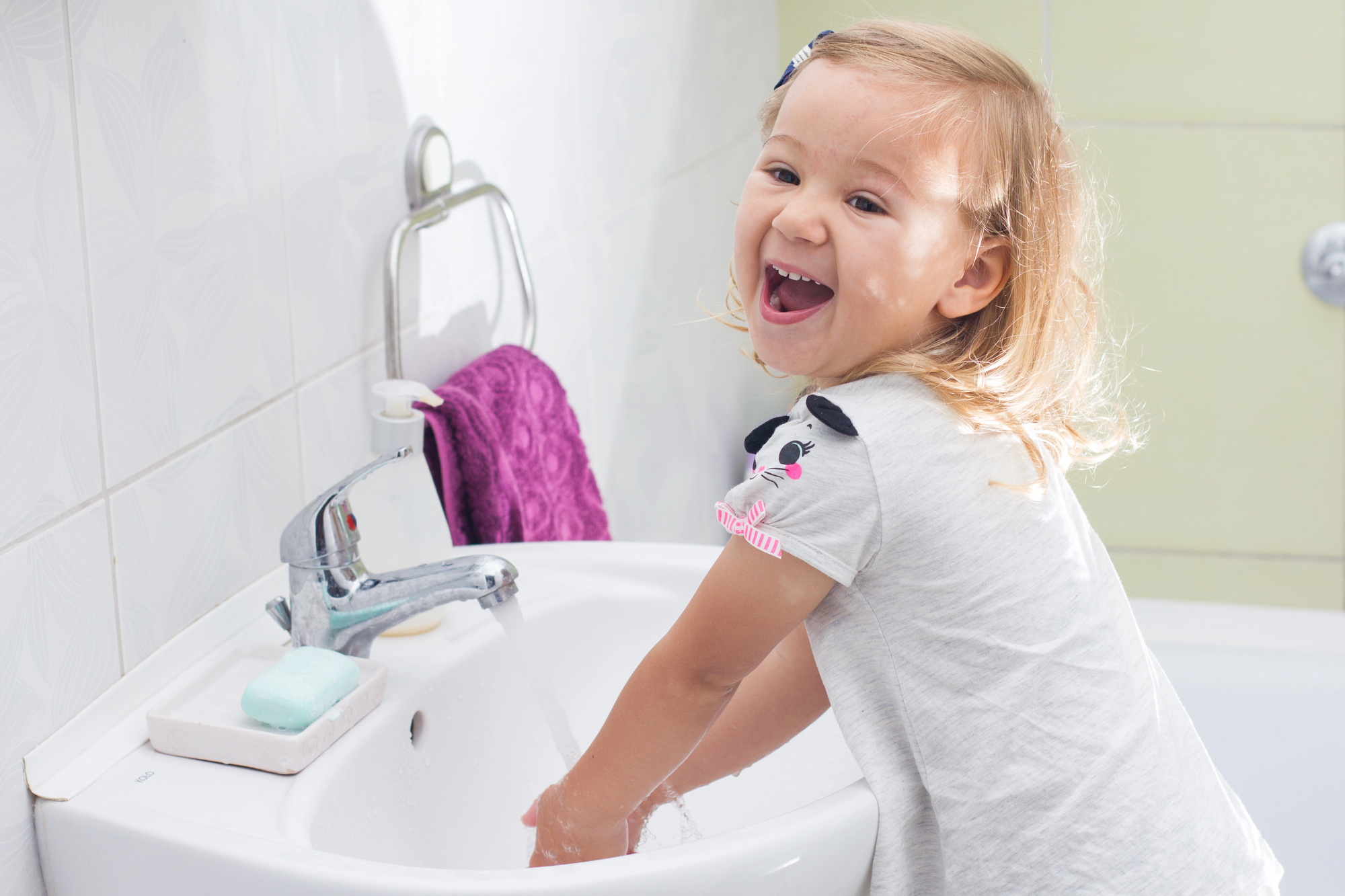 Little girl washing hands